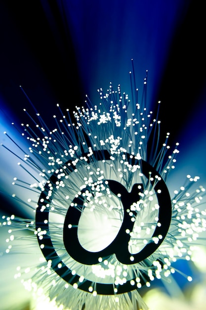 An abstract representation of data streams flowing into a secure server, protected by a digital shield. The image conveys the importance of data security and privacy in the digital age.