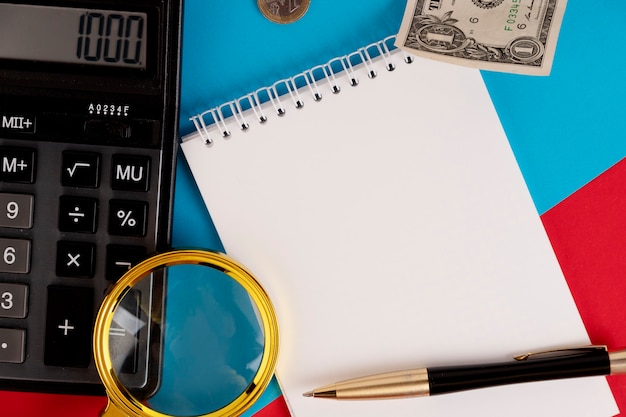 A close-up image of tax forms with a calculator and a pen, emphasizing the importance of accurate tax filing for claiming the Child Tax Credit.