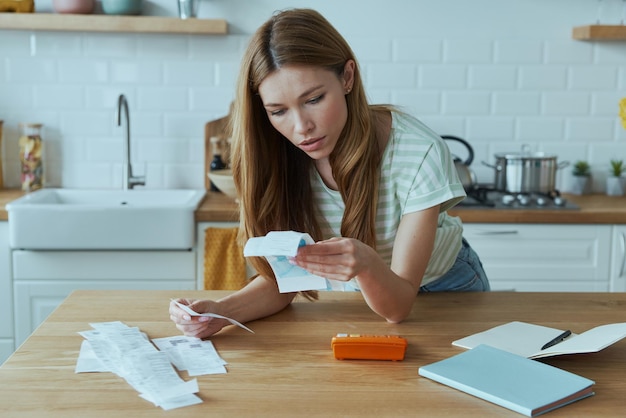 An image of a person carefully filling out a tax form at their desk, highlighting the importance of attention to detail when claiming the Child Tax Credit.