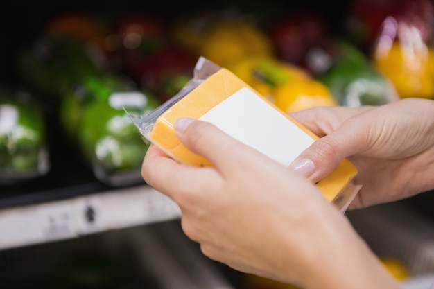 A close-up of a SNAP/EBT card being used to purchase groceries at a supermarket checkout.