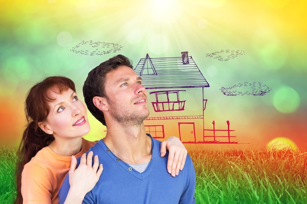 A split image showing a house with solar panels on the roof and a family happily gathered inside, highlighting energy efficiency and home comfort.