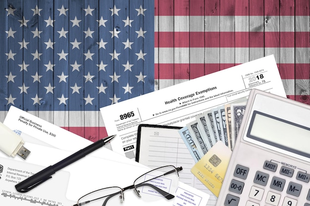 A split screen showing a calculator on one side and a US tax form on the other. The calculator displays different tax bracket calculations, illustrating how income is taxed at varying rates. The setting is a well-lit office with financial documents stacked neatly.