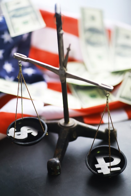 A scales of justice balancing tax forms on one side and dollar bills on the other, set against a dark, ominous background. This symbolizes the importance of balancing tax obligations with financial resources, highlighting the consequences of not declaring the taxes.