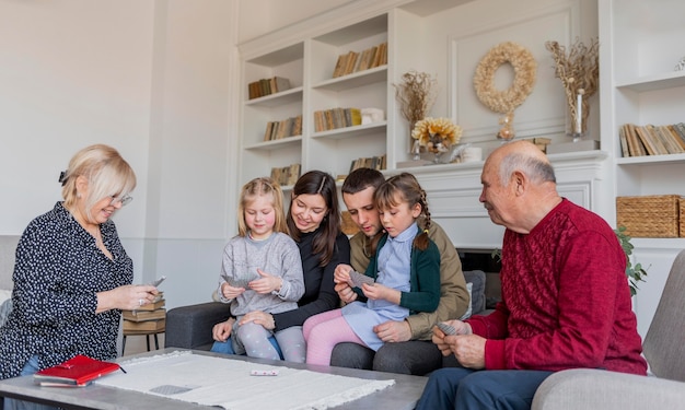 A multi-generational family gathered together indoors, symbolizing inheritance and wealth transfer.