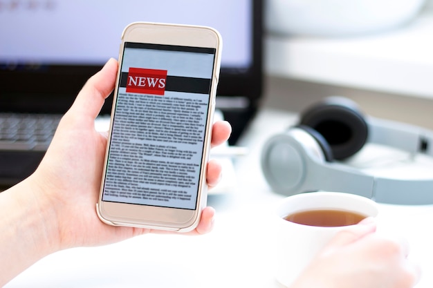 A close-up of a smartphone screen displaying a niche news aggregator app, showing headlines about environmental issues and local community events. The app interface is clean and user-friendly, with options to filter content by category and location.