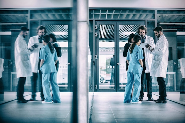 A split image showing two contrasting healthcare scenarios: on one side, a modern, well-equipped hospital with advanced technology, and on the other side, a rural clinic with fewer resources. The image aims to highlight healthcare disparities and access challenges.